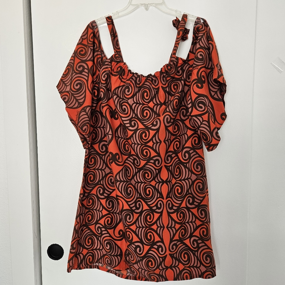 Manuhealii Vibrant Red and Brown Patterned Fabric